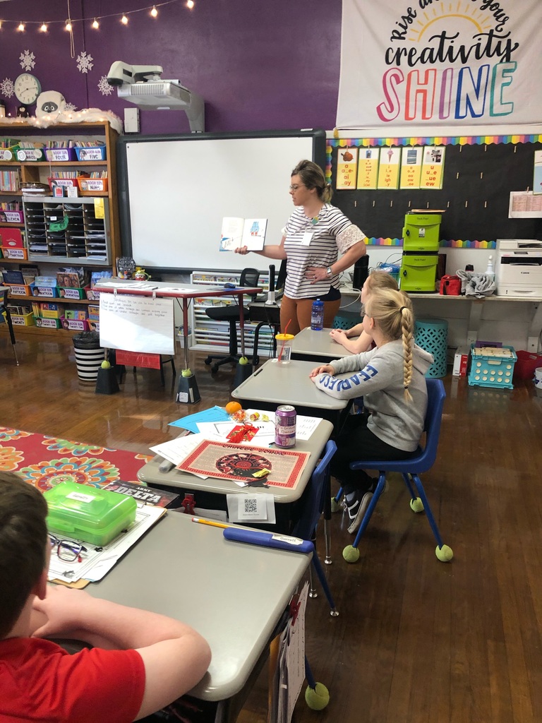 Mrs. Grant reading to third grade.