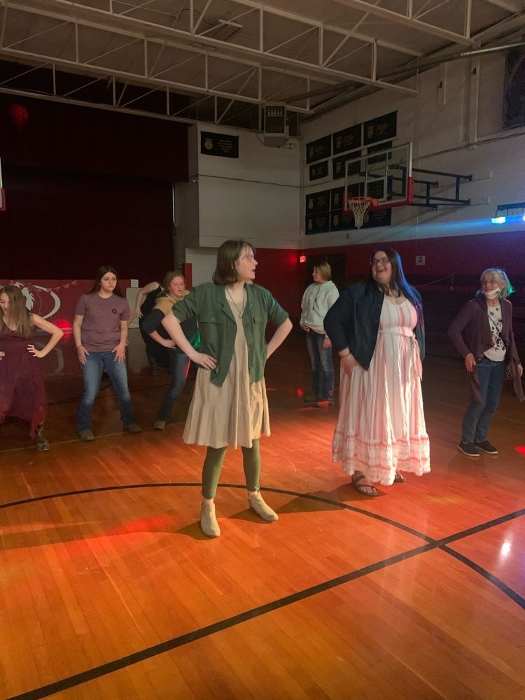 students and staff dance the Macarena